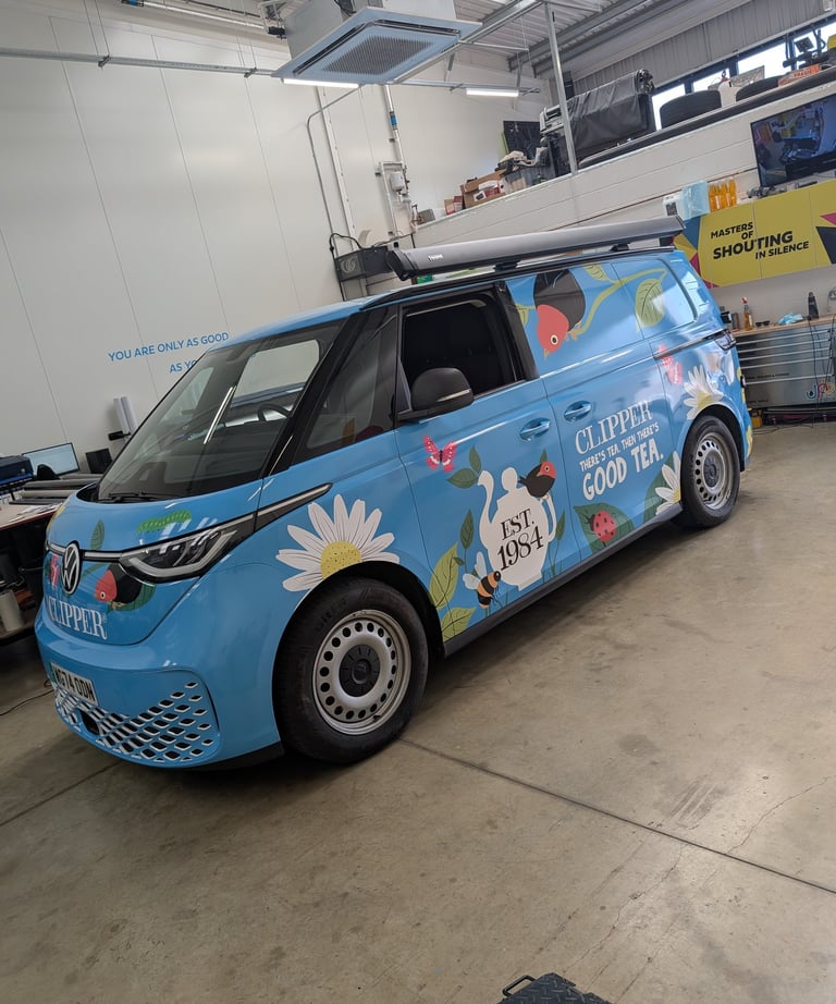 A VW ID Buzz fully wrapped in printed vinyl