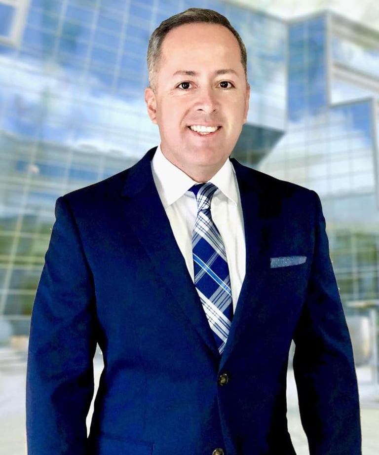 a man in a suit and tie smiling