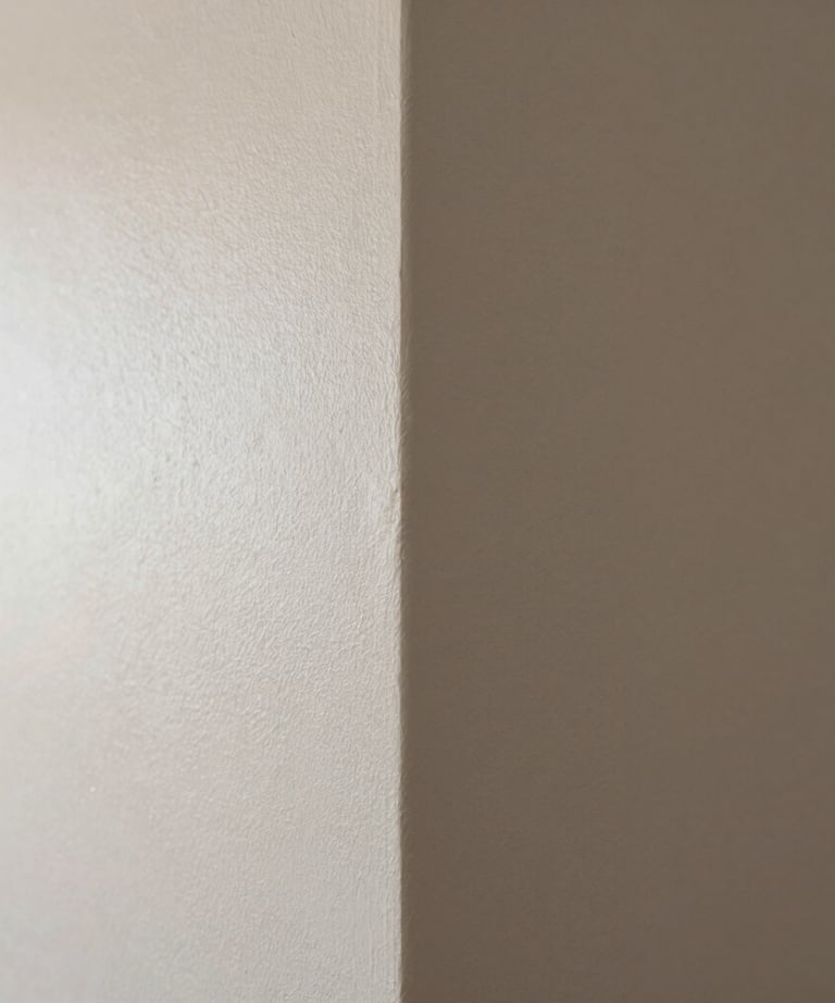 Close-up of a perfectly painted wall corner with invisible seams. Soft daylight highlighting the texture-free surface. High-end Brazilian apartment.