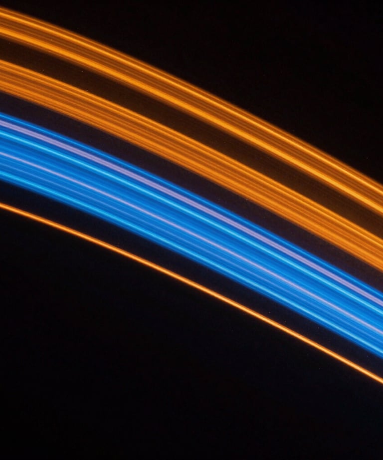 Abstract close-up of light painting in a dark studio, creating cinematic streaks of orange and blue. Representing creativity and innovation.