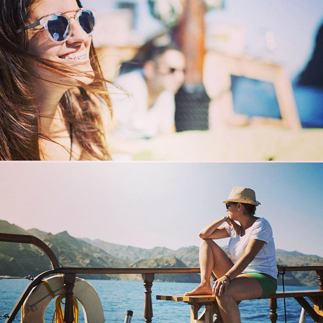 a woman sitting on a boat in the ocean