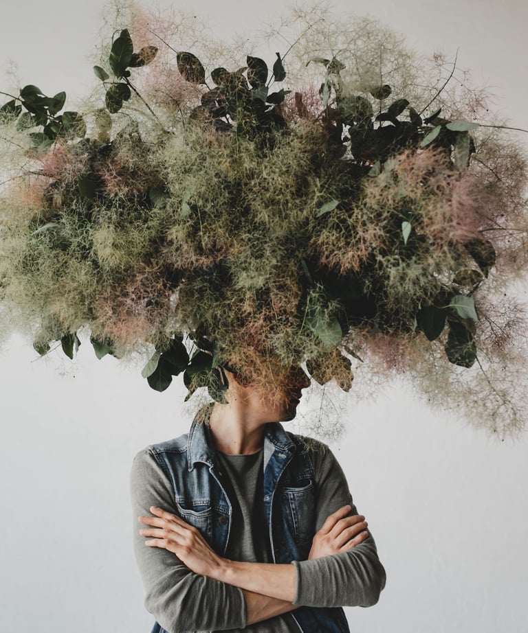 a man with a large head of flowers on his head