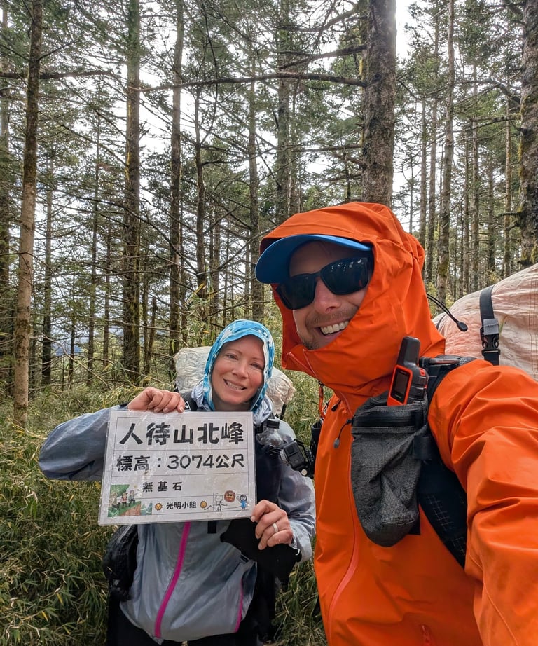 don and samantha on a forested mountain summit in the central range of taiwan