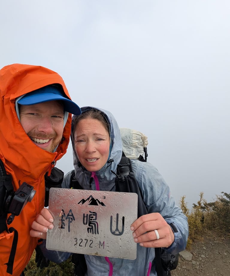 don and samantha on the summit of lingming moutain in the central range of taiwan