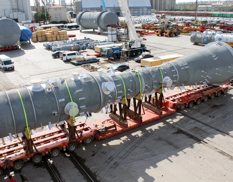a large pipe - top truck with a large pipe on it