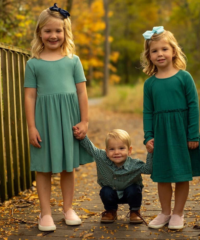 three young children holding hands
