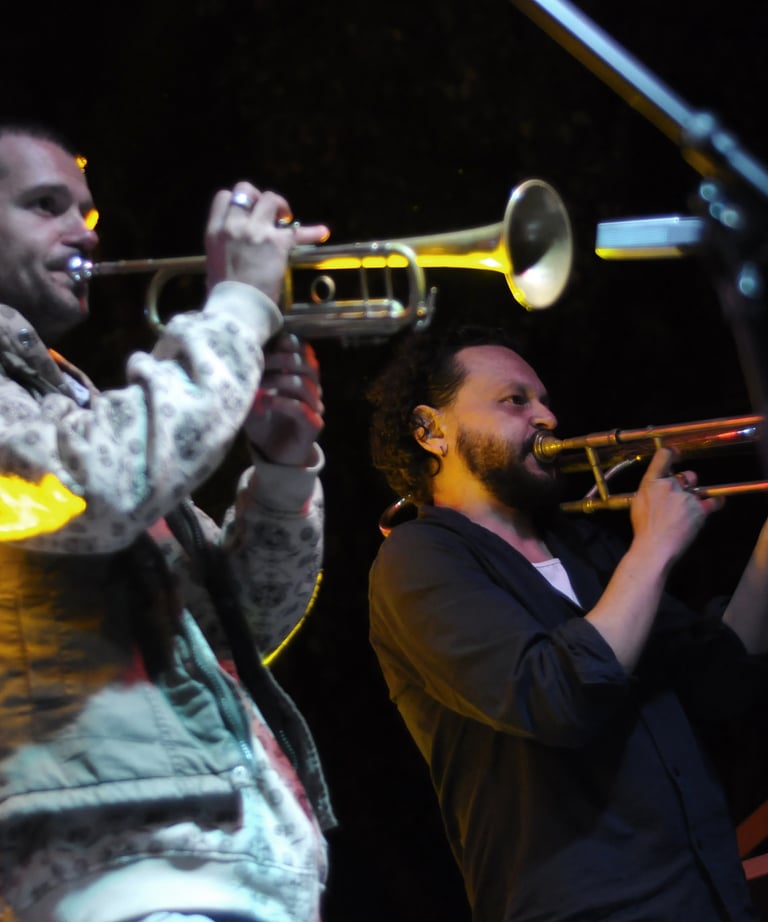 a man playing a trumpet in a band
