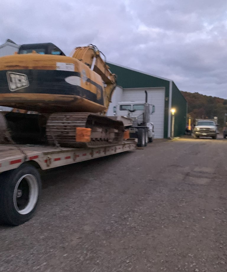 jcb track hoe going to job
