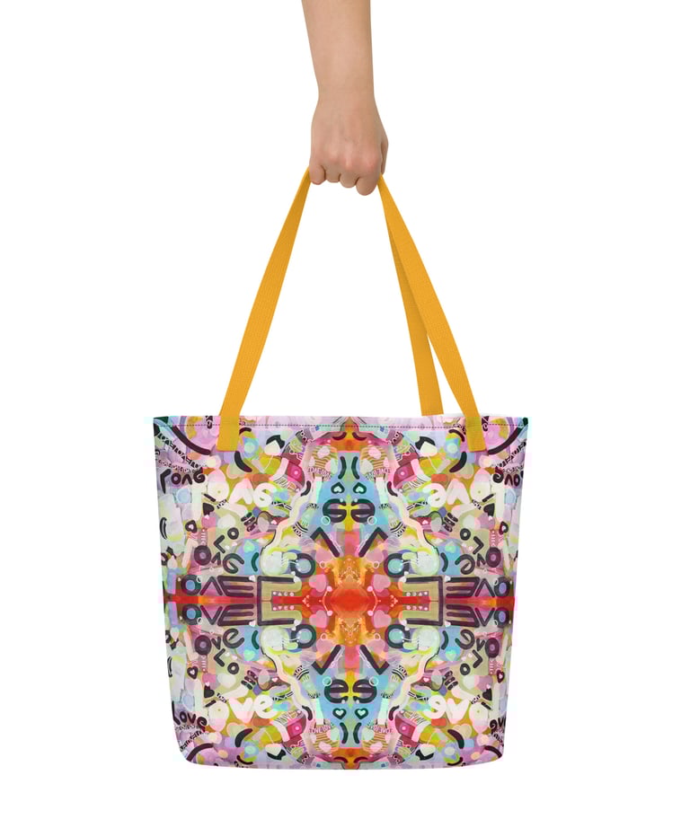 a person holding a colorful bag with a colorful pattern