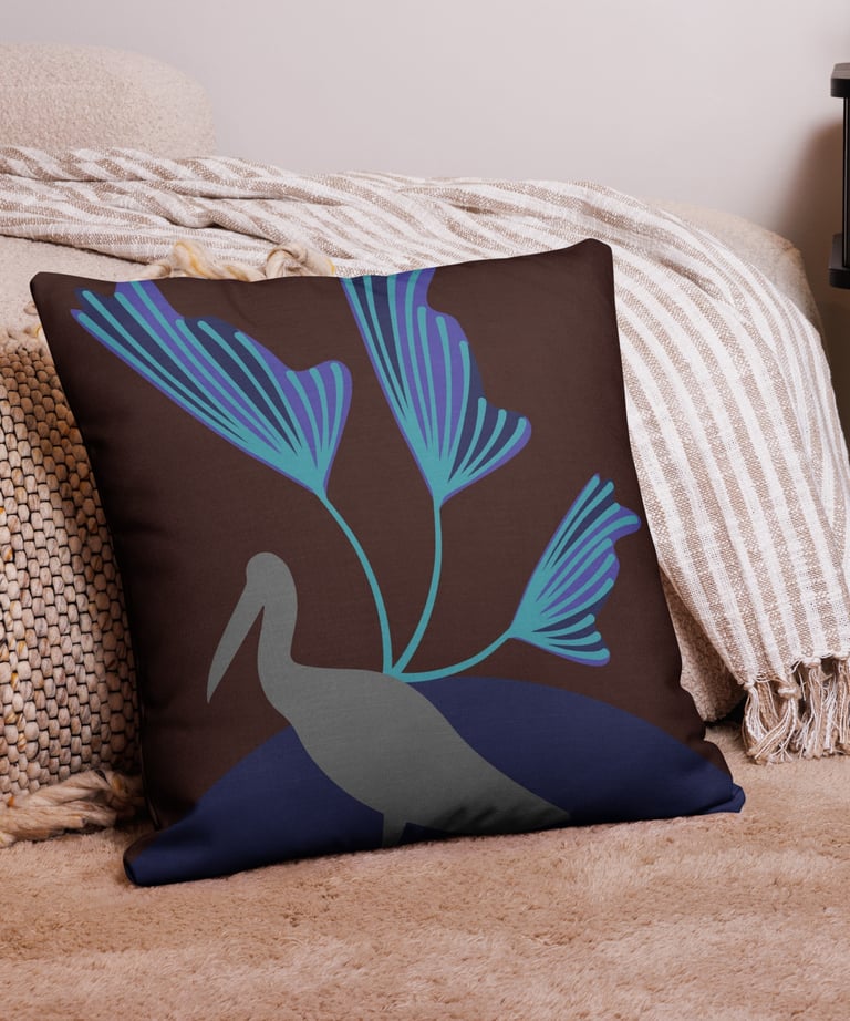 a decorative pillow with a bird on it