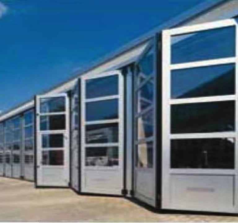 a long line of doors leading to a building