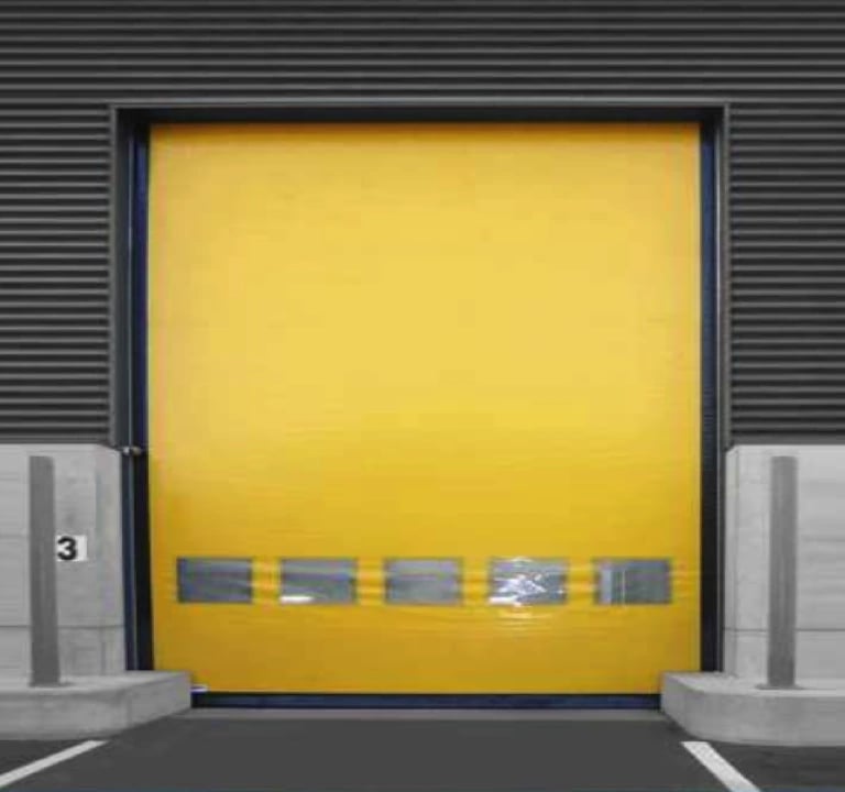 a yellow door with a yellow door and a parking lot