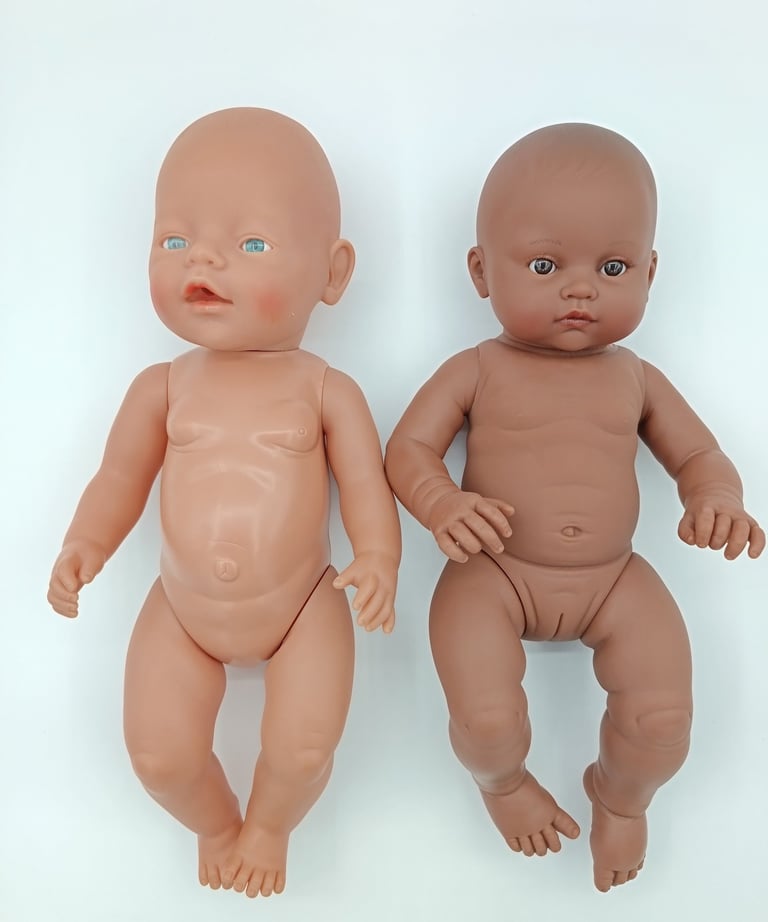 Baby Born doll compared to Minikane Les Bambinis doll