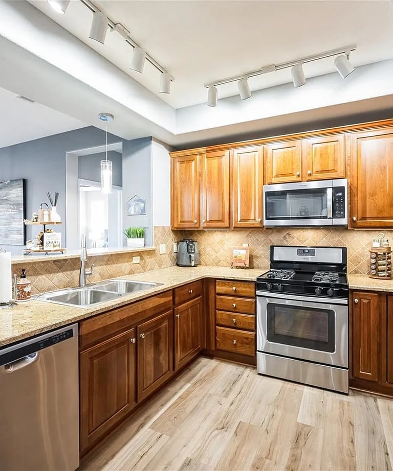 SparkEaseCleaning cleaned kitchen with stainless steel appliances in a Denver home
