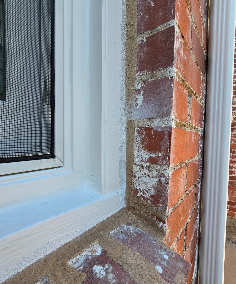 Two perfectly straight caulk lines that meet to create a water tight seal for a window