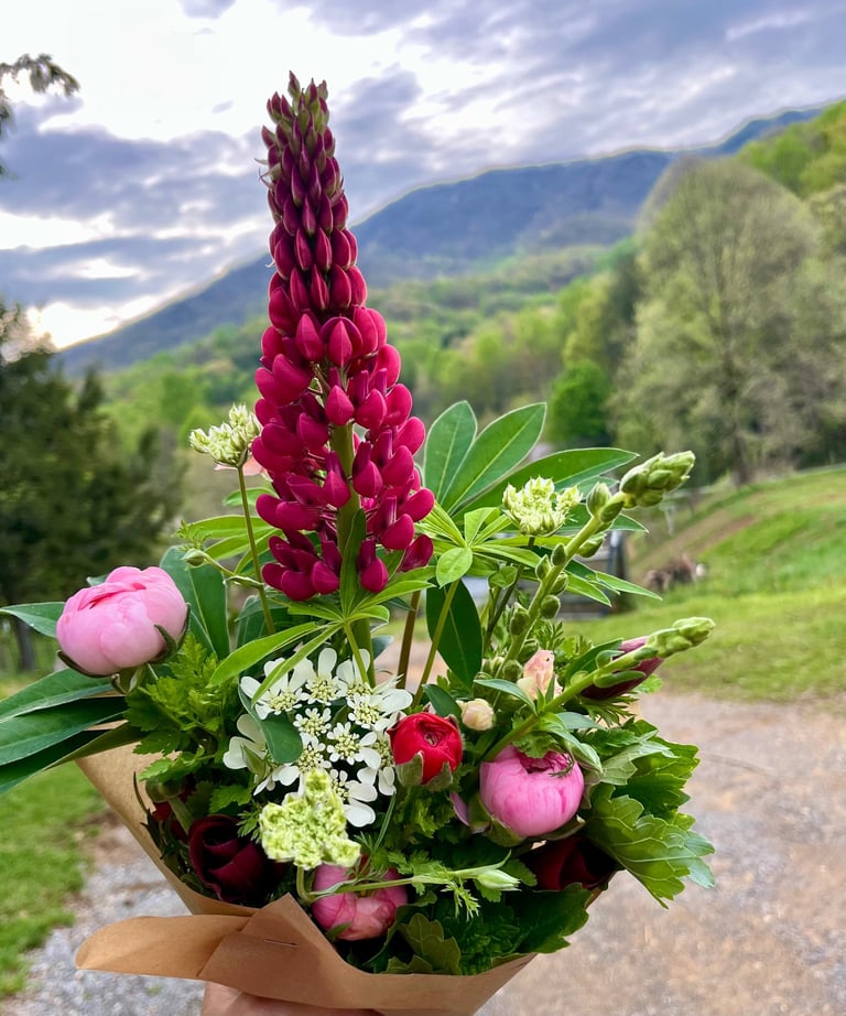 Vibrant red column delicate petaled flower in an arrange bouquet