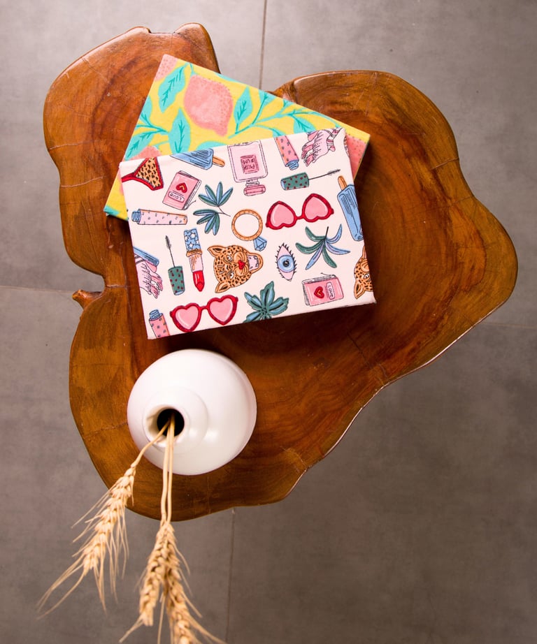 a small house with a paper house on a table