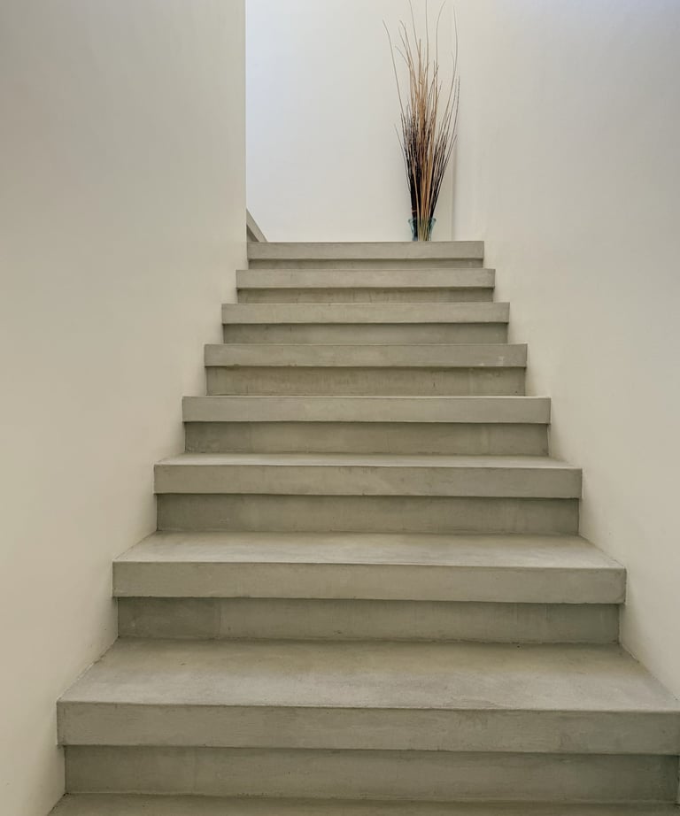 a planter with a vase on top of it