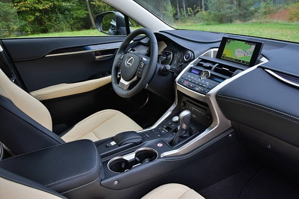 a car dashboard with a steering wheel and dashboard