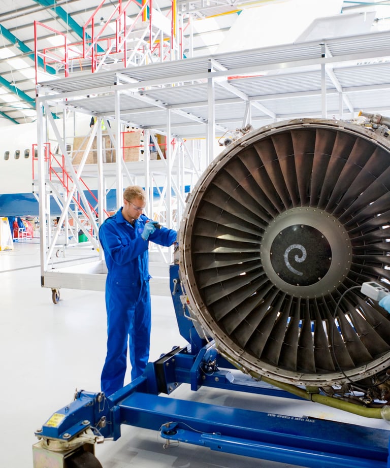 an aerospace engine inspection being taken place by an engineer with a borescope