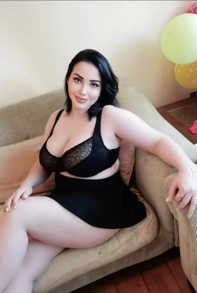 A Russian Escort woman in a black braille braille bra