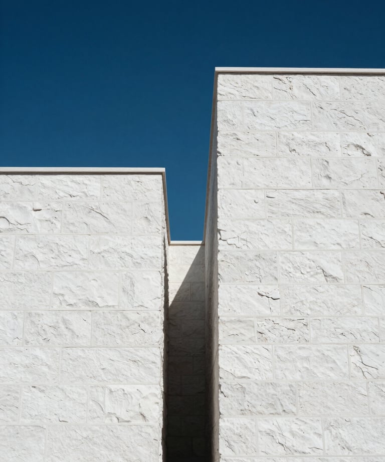 Clean, minimalist shot of architectural details in Bodrum: white stone walls against a deep blue sky. High contrast and modern. Turkish / Aegean Coast.