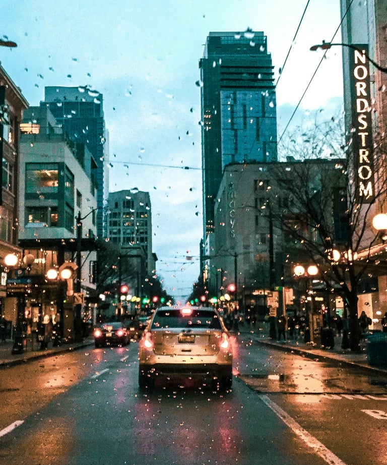 Rainy Seattle street with glistening wet pavement and iconic city charm.