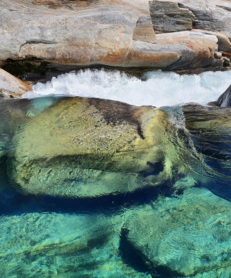 a large rock formation in the water