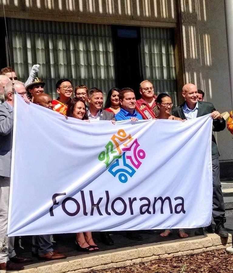 a group of people standing in front of a banner