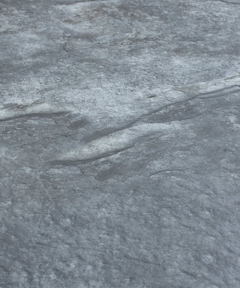 A soft stone slate featuring a unique black and gold veining pattern, ideal for elegant wall designs