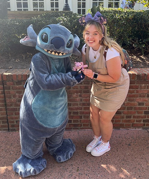 Ameliah Knopp pictured with Stitch at EPCOT®.