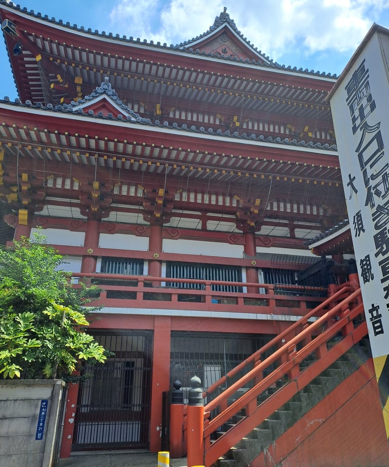 Traditional red and white Japanese temple architecture at Osu Kannon in Nagoya, Japan.