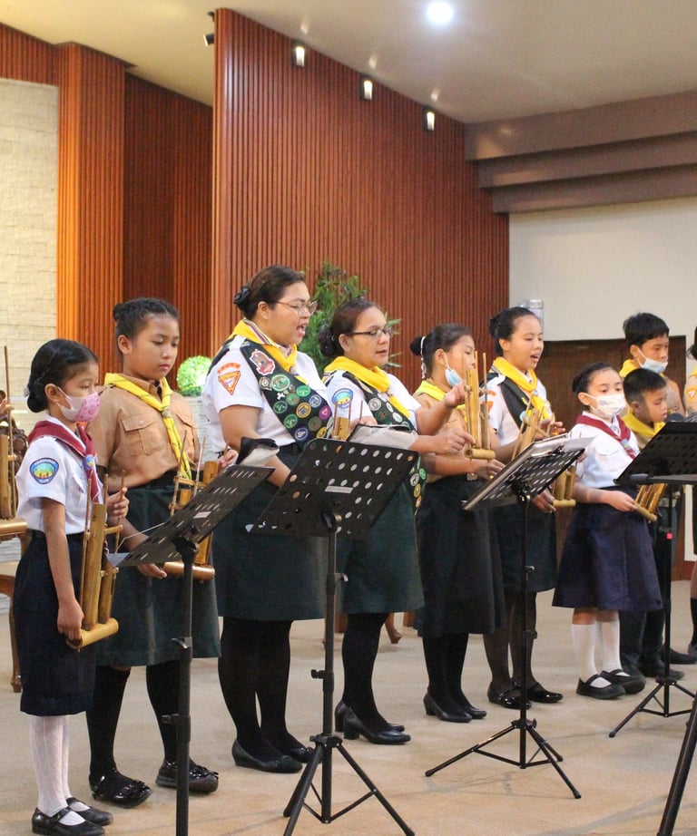 Female scouts speaking on a stage