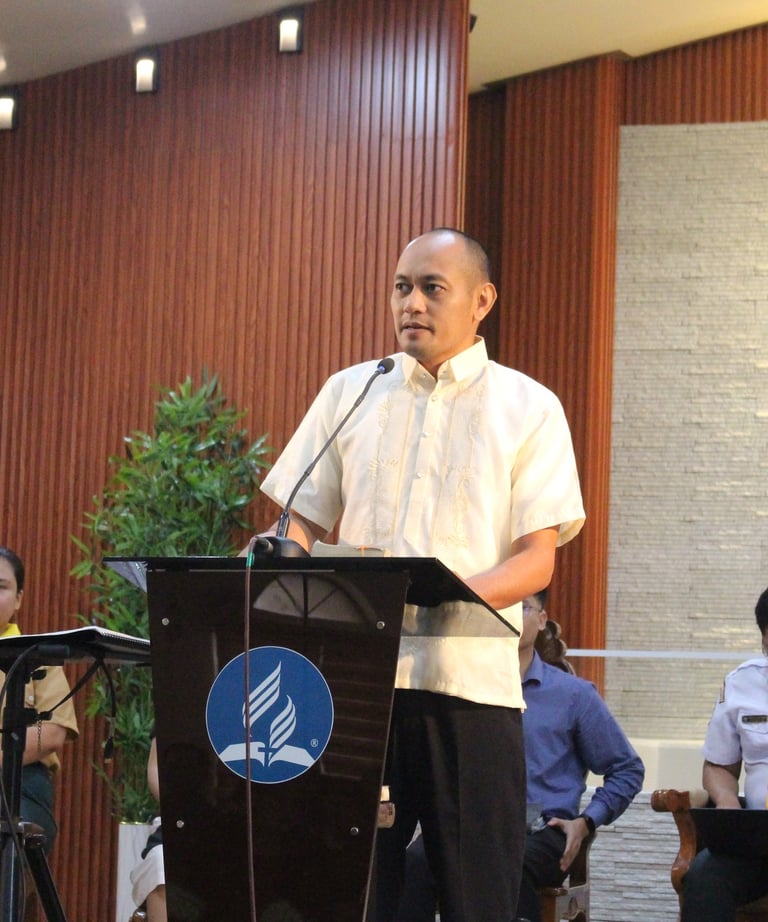 Man speaking on a podium
