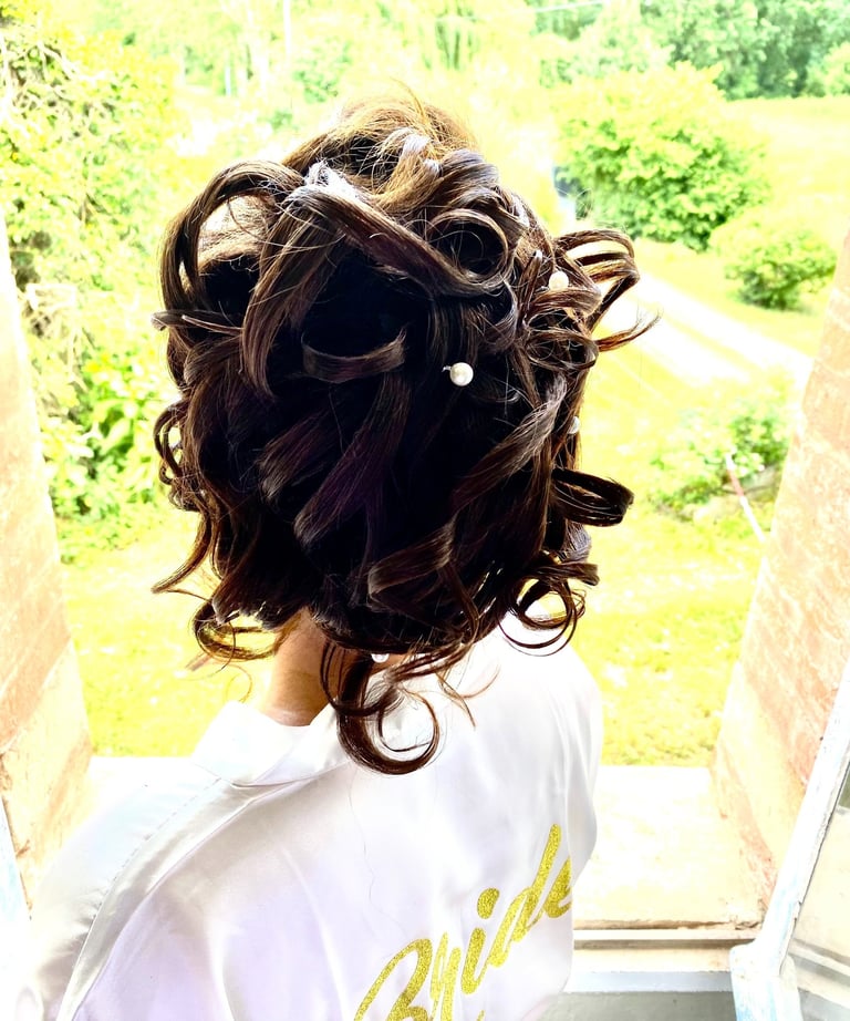 a woman with a hairdoodle and a white shirt