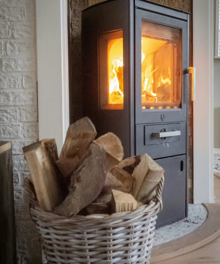 Image of a roaring fireplace with a basket of wood in front