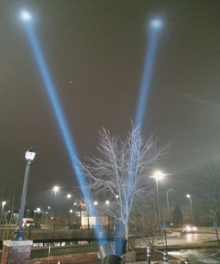 5k searchlights hitting fog in sky