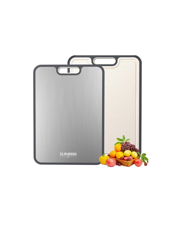 Set of two reversible stainless steel and plastic cutting boards with fresh fruit for kitchen use.