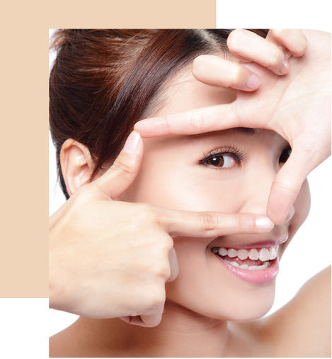 a woman with a smile on her face and hands on her face