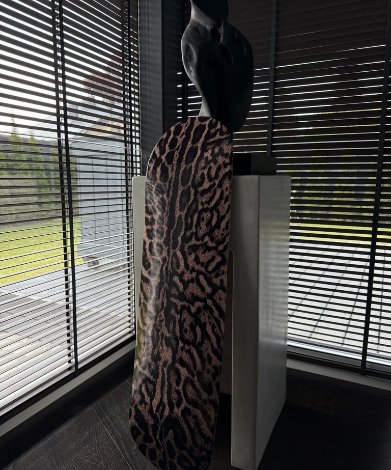 skateboard wall art next to statue