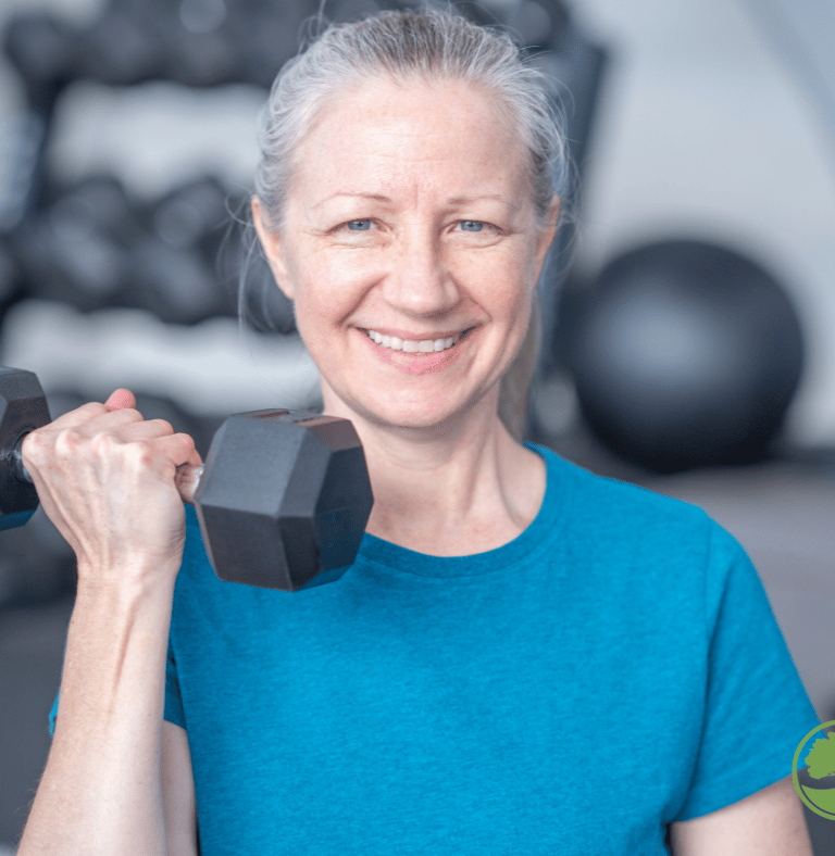 a woman doing strength training with a dumbbell in her hand