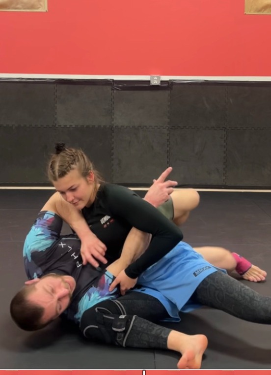 Personal Trainer teaching young Woman Self Defense