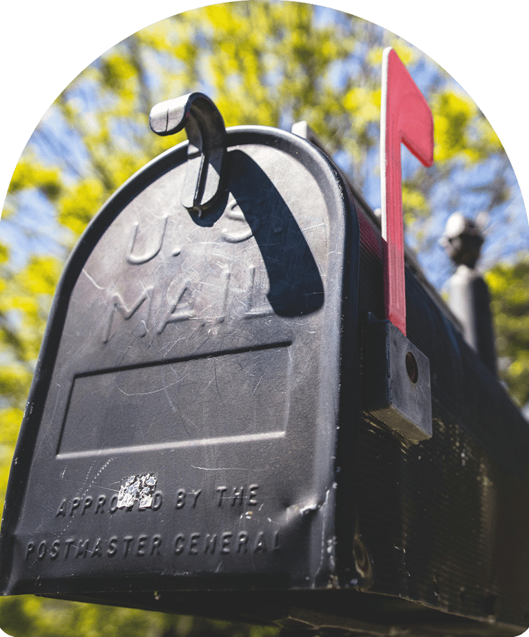 black mailbox with red flag signifying there is mail 