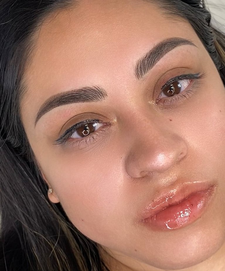 Close-up view of the natural, airy front strokes of a combo brow.