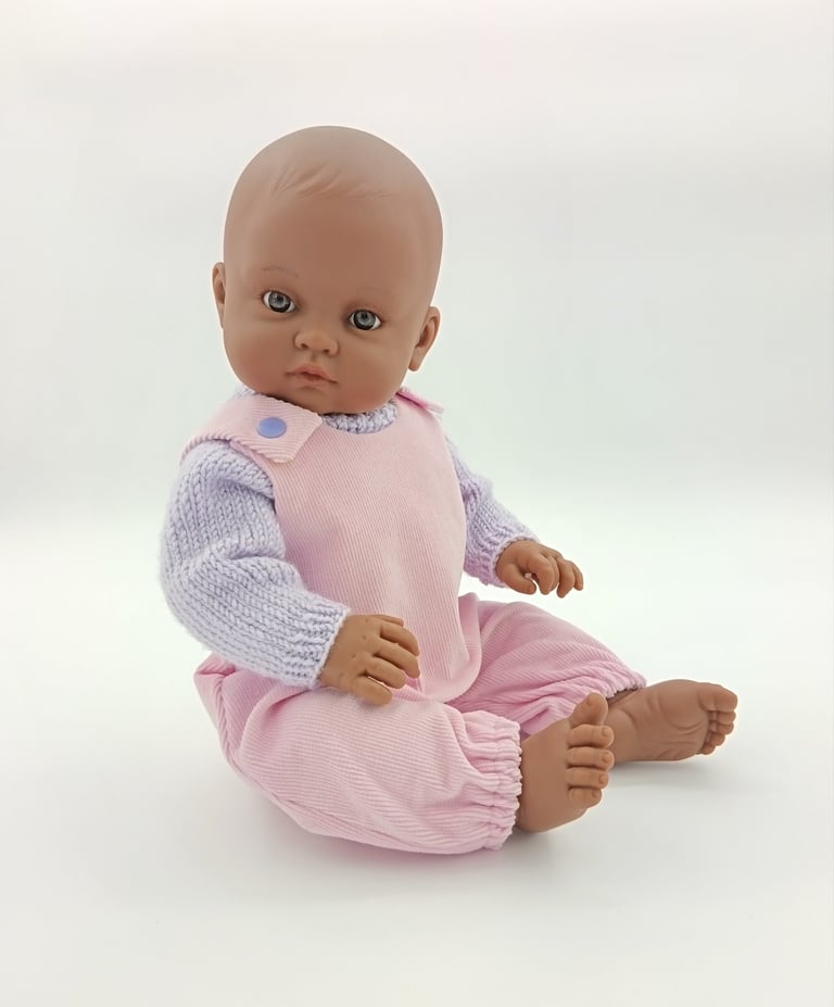 Minikane doll wearing Baby Born outfit