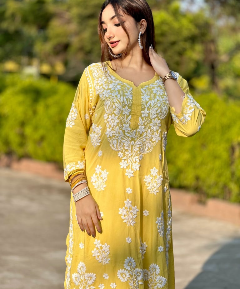 a woman in a yellow dress with a white dress