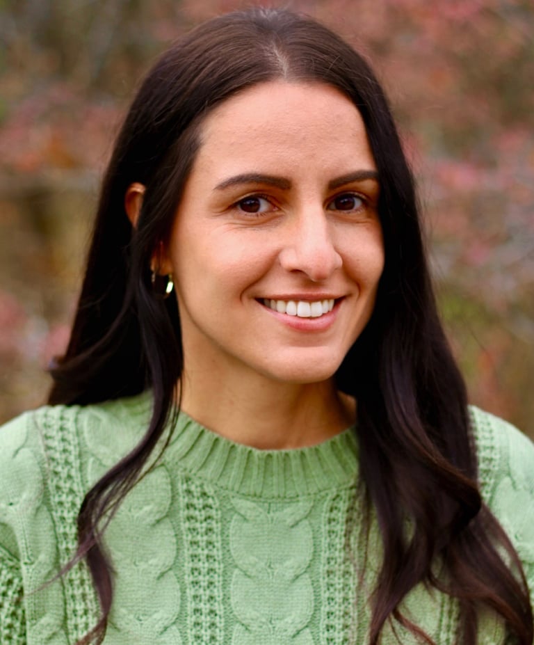 Lisa, the founder of Mother's Milk, smiling warmly, embodying compassionate lactation support.