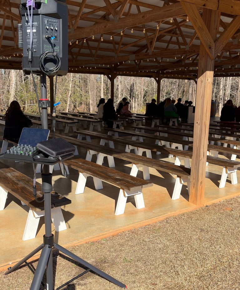 Professional DJ setup with Mackie Thump GO and tripod