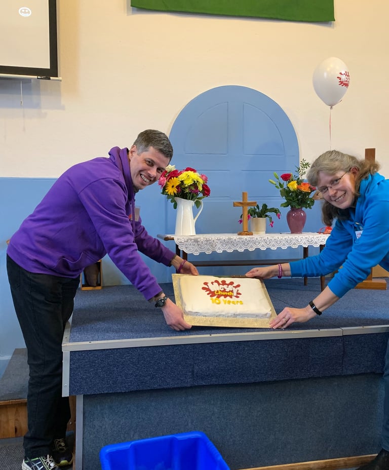 People with a celebration cake