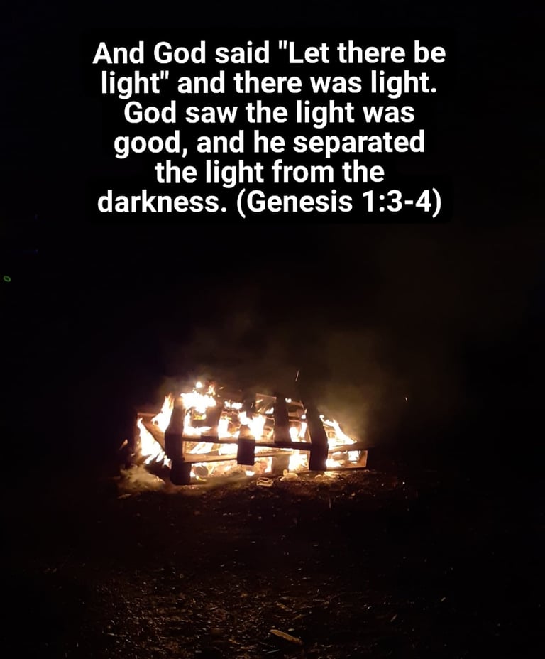 Bonfire with text from Genesis chapter 1